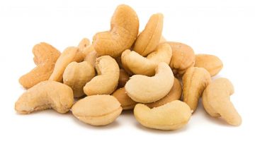 Heap of cashew nuts isolated on white background